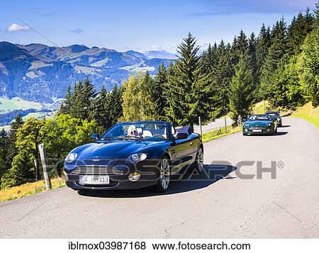 "Aston Martin DB7 Vantage Volange cars on a mountain road near Kitzbuhel, Tyrol, Austria, Europe" View Large Photo Image Stock Photo - "Aston Martin DB7 Vantage Volange cars on a mountain road near Kitzbuhel, Tyrol, Austria, Europe". Fotosearch