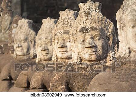 Stock Photo - "Asura statues aligned at the south gate causeway of Angkor Thom, Siem Reap, Cambodia, Asia". Fotosearch