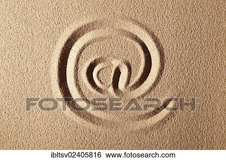"At symbol, drawn in sand" View Large Photo Image Stock Photograph - "At symbol, drawn in sand". Fotosearch