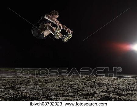 Athlete at the long jump View Large Photo Image Stock Image - Athlete at the long jump. Fotosearch