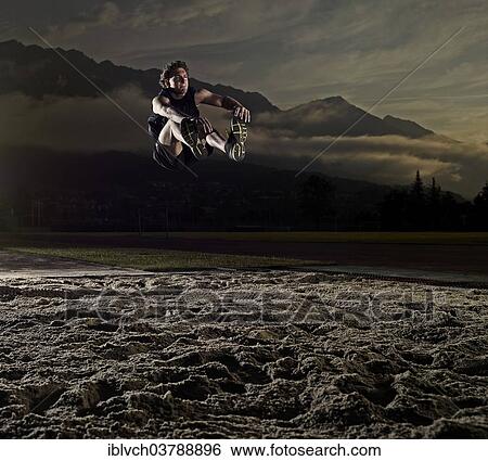 Athlete at the long jump View Large Photo Image Stock Photograph - Athlete at the long jump. Fotosearch