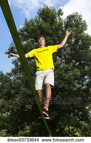 "Athlete balancing on a slackline, Waiblingen, Baden-Wurttemberg, Germany, Europe" View Large Photo Image Picture - "Athlete balancing on a slackline, Waiblingen, Baden-Wurttemberg, Germany, Europe". Fotosearch