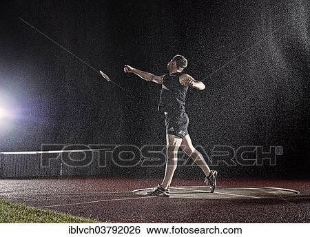 Athlete throwing a discus View Large Photo Image Stock Photograph - Athlete throwing a discus. Fotosearch