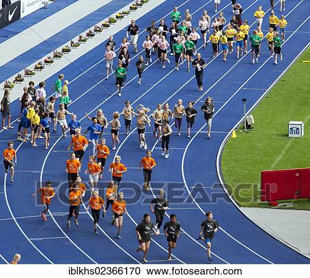 Stock Image - "Athletic children of Berlin schools taking part in a running competition at the ISTAF 2012 at the Olympic Stadium, Berlin, Germany, Europe". Fotosearch