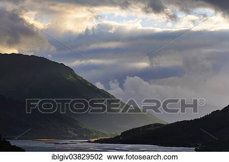 Stock Image - "Atmospheric clouds over Loch Leven, Glen Coe, Ross Skye and Lochaber, Scottish Highlands, Scotland, United Kingdom, Europe". Fotosearch