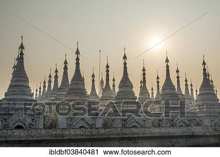 Stock Image - "Atthakatha chedis or stupas, Sandamuni Paya or Sandamuni Pagoda, temple complex in Mandalay, Mandalay Region, Myanmar, Asia". Fotosearch