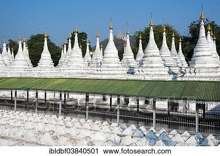 "Atthakatha chedis or stupas, Sandamuni Paya or Sandamuni Pagoda, view of Mandalay Hill, temple complex in Mandalay, Mandalay Region, Myanmar, Asia" View Large Photo Image Stock Image - "Atthakatha chedis or stupas, Sandamuni Paya or Sandamuni Pagoda, view of Mandalay Hill, temple complex in Mandalay, Mandalay Region, Myanmar, Asia". Fotosearch