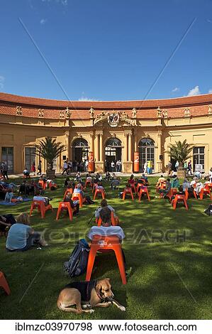 "Audience at the annual Poetry Festival in the Castle Garden in front of the Orangery, Erlangen, Middle Franconia, Bavaria, Germany, Europe" View Large Photo Image Stock Photo - "Audience at the annual Poetry Festival in the Castle Garden in front of the Orangery, Erlangen, Middle Franconia, Bavaria, Germany, Europe". Fotosearch