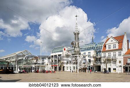 "Aurich market square with the market hall and the Sous Tower artwork, Aurich, East Frisia, Lower Saxony, Germany, Europe" View Large Photo Image Stock Image - "Aurich market square with the market hall and the Sous Tower artwork, Aurich, East Frisia, Lower Saxony, Germany, Europe". Fotosearch