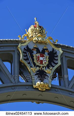 Stock Image - "Austrian coat of arms on the border bridge between Bavaria and Salzburg State, Laufen, Chiemgau region, Upper Bavaria, Bavaria, Germany, and Oberndorf, Salzburg State, Austria, Europe". Fotosearch