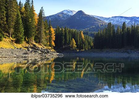 "Autumn forest reflecting in Oberberner See or Lake Obernberg, Obernbergersee, Obernberg, Tyrol, Austria, Europe" View Large Photo Image Stock Photograph - "Autumn forest reflecting in Oberberner See or Lake Obernberg, Obernbergersee, Obernberg, Tyrol, Austria, Europe". Fotosearch