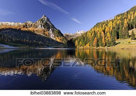 "Autumnal coloured trees, reflections in a lake, Lungau, Riedingtal, Austria, Europe" View Large Photo Image Stock Photo - "Autumnal coloured trees, reflections in a lake, Lungau, Riedingtal, Austria, Europe". Fotosearch