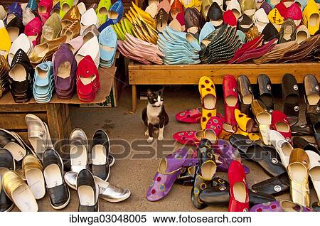 "Babouches, cat sitting amidst typical Moroccan slippers, souks, Medina, Altstadt, Fes, Morocco, Africa" View Large Photo Image Stock Photography - "Babouches, cat sitting amidst typical Moroccan slippers, souks, Medina, Altstadt, Fes, Morocco, Africa". Fotosearch