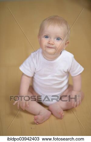 "Baby, 7 months, smiling whimsically" View Large Photo Image Stock Image - "Baby, 7 months, smiling whimsically". Fotosearch