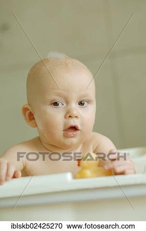 Baby in a bath with foam on his head View Large Photo Image Stock Image - Baby in a bath with foam on his head. Fotosearch