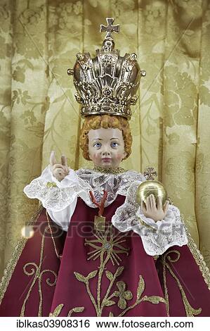 Stock Photograph - "Baby Jesus with crown and orb, children's doll in a Sicilian Baroque church, Palermo, Sicily, Italy, Europe". Fotosearch