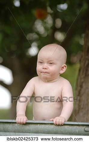 "Baby, one year, bathing in a zinc tub outdoors" View Large Photo Image Stock Image - "Baby, one year, bathing in a zinc tub outdoors". Fotosearch