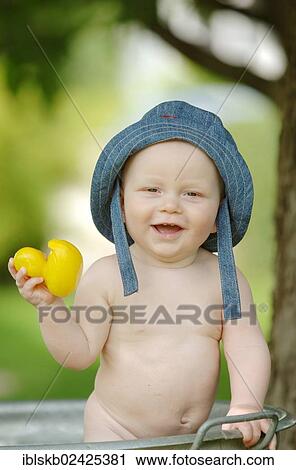 "Baby, one year, bathing in a zinc tub outdoors" View Large Photo Image Stock Image - "Baby, one year, bathing in a zinc tub outdoors". Fotosearch
