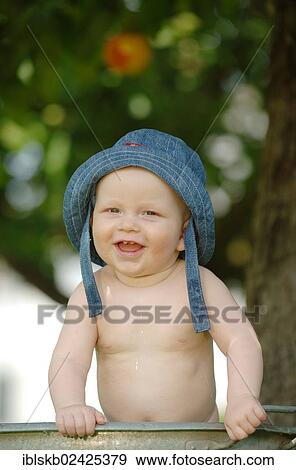 "Baby, one year, bathing in a zinc tub outdoors" View Large Photo Image Stock Photo - "Baby, one year, bathing in a zinc tub outdoors". Fotosearch