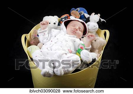 Baby sleeping in a bucket full of stuffed animals View Large Photo Image Stock Photo - Baby sleeping in a bucket full of stuffed animals. Fotosearch