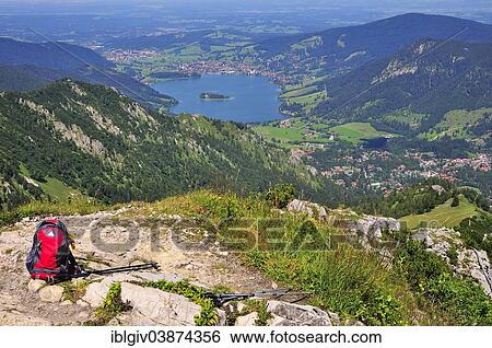 "Backpack and hiking poles at a lookout point, views of Schliersee Lake, Mt Brecherspitz, Schliersee, Upper Bavaria, Bavaria, Germany, Europe" View Large Photo Image Stock Photograph - "Backpack and hiking poles at a lookout point, views of Schliersee Lake, Mt Brecherspitz, Schliersee, Upper Bavaria, Bavaria, Germany, Europe". Fotosearch