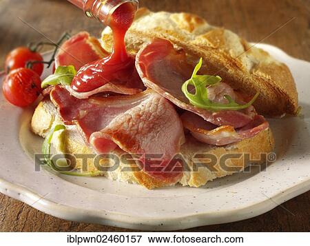 Bacon sandwich with tomato ketchup View Large Photo Image Stock Photo - Bacon sandwich with tomato ketchup. Fotosearch