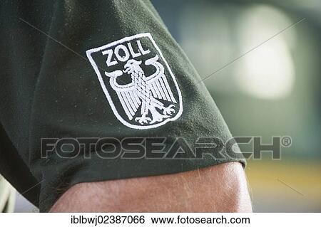 "Badge """"Zoll"""", German for """"Customs"""" on the uniform of a customs official, Germany, Europe" View Large Photo Image Stock Photograph - "Badge """"Zoll"""", German for """"Customs"""" on the uniform of a customs official, Germany, Europe". Fotosearch