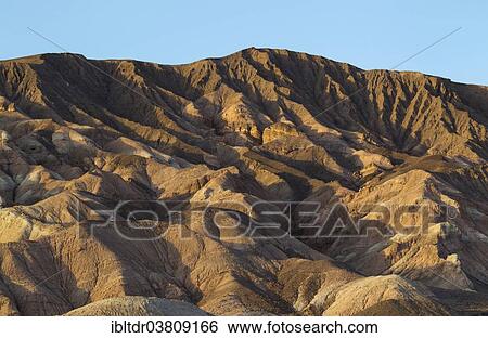 "Badlands at the western foothills of the Grapevine Mountains in the Death Valley, Death Valley National Park, California, USA" View Large Photo Image Stock Photograph - "Badlands at the western foothills of the Grapevine Mountains in the Death Valley, Death Valley National Park, California, USA". Fotosearch