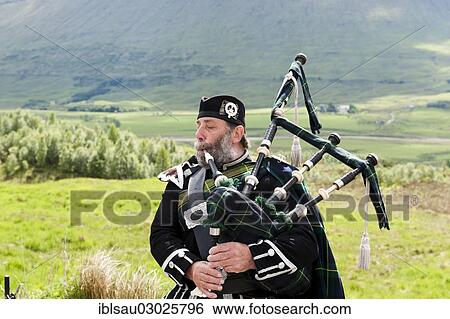 "Bagpiper in the Scottish Highlands, Highland, Highlands, Rannoch Moor, Schottland, Scotland, United Kingdom, Europe" View Large Photo Image Stock Photograph - "Bagpiper in the Scottish Highlands, Highland, Highlands, Rannoch Moor, Schottland, Scotland, United Kingdom, Europe". Fotosearch