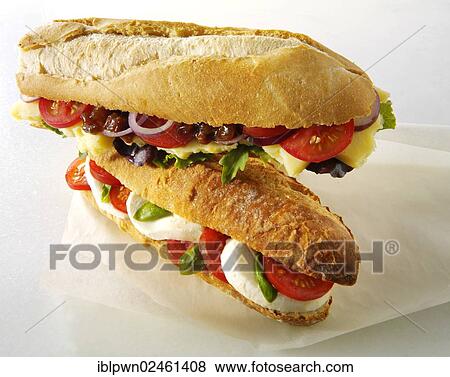 "Baguettes filled with mozzarella and tomatoes, and cheddar ploughman's with chutney" View Large Photo Image Stock Photo - "Baguettes filled with mozzarella and tomatoes, and cheddar ploughman's with chutney". Fotosearch