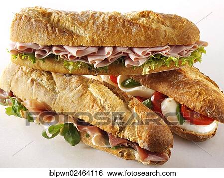 "Baguettes filled with mozzarella and tomatoes, ham and salad, Prosciutto ham and rocket" View Large Photo Image Stock Photograph - "Baguettes filled with mozzarella and tomatoes, ham and salad, Prosciutto ham and rocket". Fotosearch