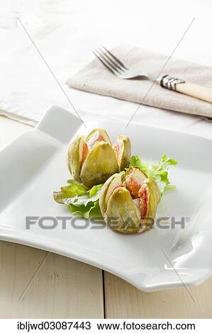 Baked figs stuffed with camembert cheese View Large Photo Image Stock Image - Baked figs stuffed with camembert cheese. Fotosearch