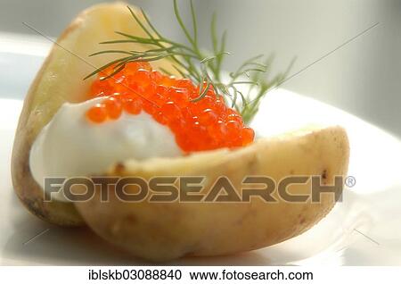 Baked potato with caviar and dill View Large Photo Image Stock Image - Baked potato with caviar and dill. Fotosearch