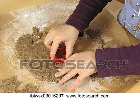 "Baking Christmas cookies, girl, 6, cutting out cinnamon stars with a cookie cutter, Mundingen, Emmendingen |Emmendingen|, Baden-Wurttemberg, Germany, Europe" View Large Photo Image Stock Photo - "Baking Christmas cookies, girl, 6, cutting out cinnamon stars with a cookie cutter, Mundingen, Emmendingen |Emmendingen|, Baden-Wurttemberg, Germany, Europe". Fotosearch