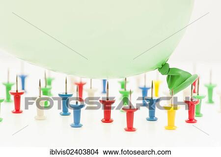 Balloon falling on pins View Large Photo Image Picture - Balloon falling on pins. Fotosearch