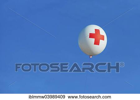 Balloon of the Red Cross in the blue sky View Large Photo Image Stock Photo - Balloon of the Red Cross in the blue sky. Fotosearch