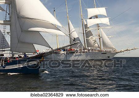 "Baltic Beauty, a two-masted brigantine sailing ship, in front of Star Flyer during Hanse Sail 2012, Warnemuende, Mecklenburg-Western Pomerania, Germany, Europe" View Large Photo Image Stock Photo - "Baltic Beauty, a two-masted brigantine sailing ship, in front of Star Flyer during Hanse Sail 2012, Warnemuende, Mecklenburg-Western Pomerania, Germany, Europe". Fotosearch