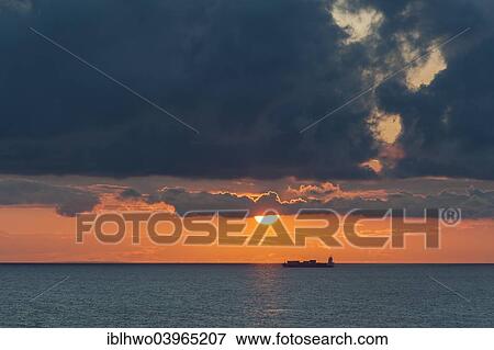 "Baltic Sea at sunset, container ship at the back, clouds, off the island of Gotland, Sweden, Europe" View Large Photo Image Stock Photo - "Baltic Sea at sunset, container ship at the back, clouds, off the island of Gotland, Sweden, Europe". Fotosearch