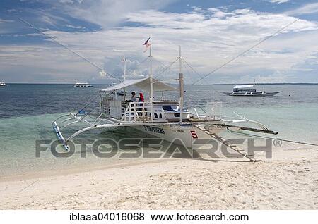 "Bangca, traditional Philippine outrigger canoe, Malapascua Island, Bohol Sea, Philippines, Asia" View Large Photo Image Stock Photo - "Bangca, traditional Philippine outrigger canoe, Malapascua Island, Bohol Sea, Philippines, Asia". Fotosearch