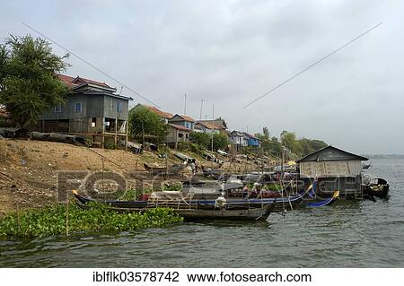 "Bank of the river Prek Tnort with fishing boats and stilt houses, Prek Chrey, Kandal province, Cambodia, Asia" View Large Photo Image Stock Image - "Bank of the river Prek Tnort with fishing boats and stilt houses, Prek Chrey, Kandal province, Cambodia, Asia". Fotosearch