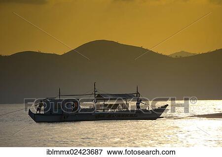 Banka, a traditional Filipino outrigger boat, anchored off the beach in the evening light, Busuanga, Philippines, Asia View Large Photo Image Stock Photo - Banka, a traditional Filipino outrigger boat, anchored off the beach in the evening light, Busuanga, Philippines, Asia. Fotosearch