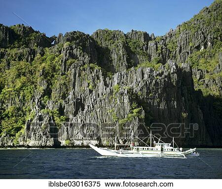 "Banka or outrigger boat off the El Nido Resorts, Miniloc Island, El Nido, Palawan, Mimaropa, Philippines, Asia" View Large Photo Image Stock Photography - "Banka or outrigger boat off the El Nido Resorts, Miniloc Island, El Nido, Palawan, Mimaropa, Philippines, Asia". Fotosearch