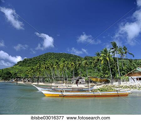 Stock Photo - "Banka or outrigger boat, palm trees, Linapacan Strait, Palawan, Mimaropa, Philippines, Asia". Fotosearch