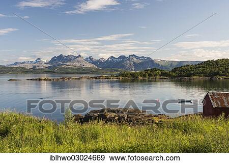 Stock Photo - "Banks of the Fjord near Bodo, Borvasstindan mountain range at back, Bodo, Skerstadfjord, Nordland, Northern Norway, Norway, Europe". Fotosearch