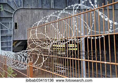 "Barbed wire, fence, fencing, industrial site, Germany, Europe" View Large Photo Image Stock Photograph - "Barbed wire, fence, fencing, industrial site, Germany, Europe". Fotosearch