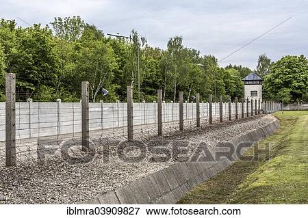 "Barbed wire fence, moat and watchtower, Dachau Concentration Camp, Dachau, Bavaria, Germany, Europe" View Large Photo Image Stock Photo - "Barbed wire fence, moat and watchtower, Dachau Concentration Camp, Dachau, Bavaria, Germany, Europe". Fotosearch