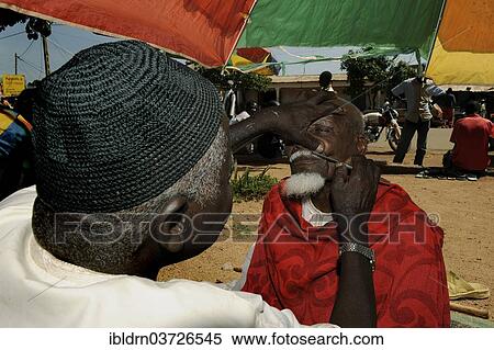 Stock Photography - "Barber at the market of Ngaoundere, Ngaoundere, Adamawa Region, Cameroon, Africa". Fotosearch