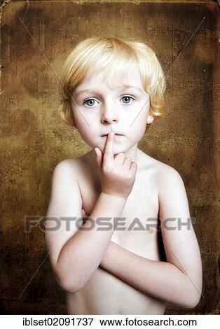 Stock Photo - "Bare chested five-year-old boy pensively putting his finger to his mouth, portrait". Fotosearch