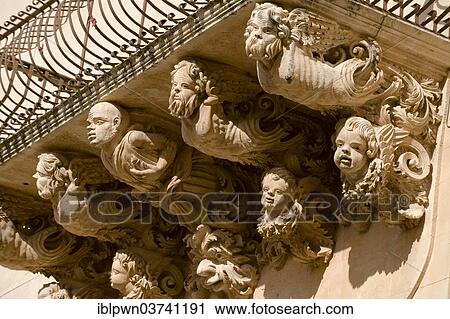 Stock Image - "Baroque balcony support sculptures, Noto, Ragusa Province, Sicily, Italy, Europe". Fotosearch
