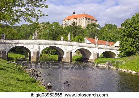 Stock Photography - "Baroque bridge with statues of Joseph Winterhalder and Namest nad Oslavou Chateau, Trebic district, Vysocina region, Czech Republic, Europe". Fotosearch